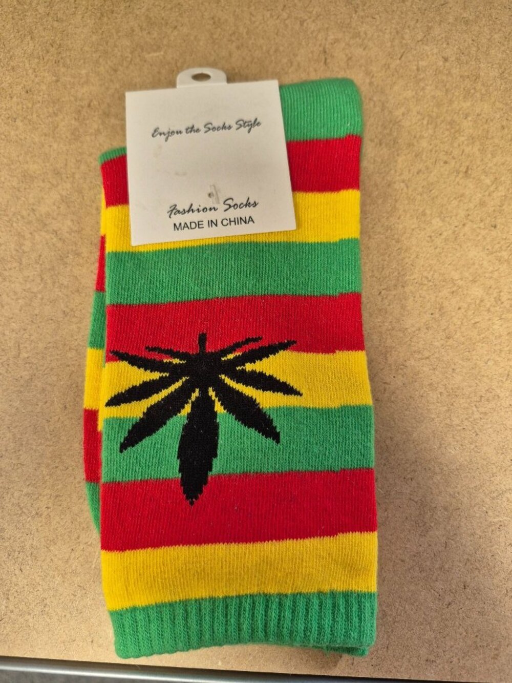 Rasta-Inspired Striped Socks With Black Leaf Design